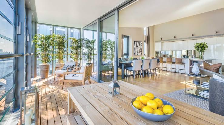 A bright, furnished flat interior opening onto a terrace