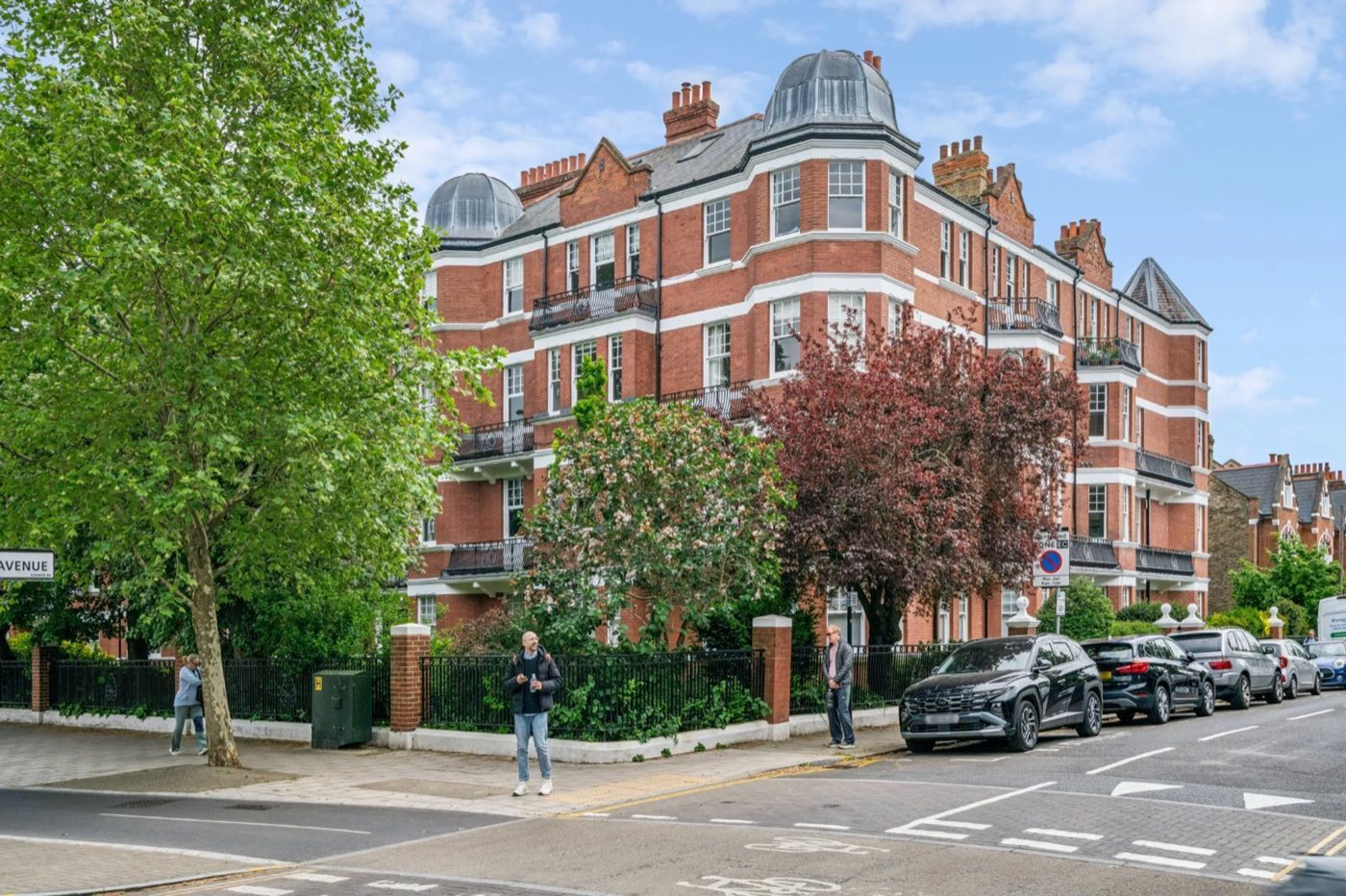 A red-brick mansion block corner typical of Chiswick