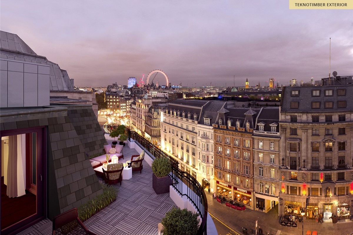 A London rooftop terrace at dusk