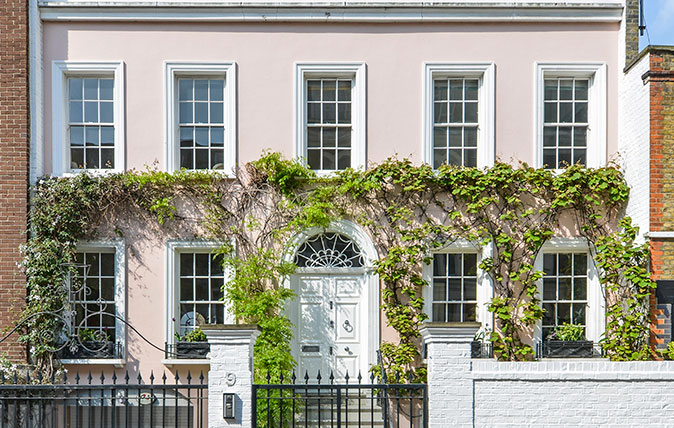 A pink Georgian townhouse typical of a London postcode