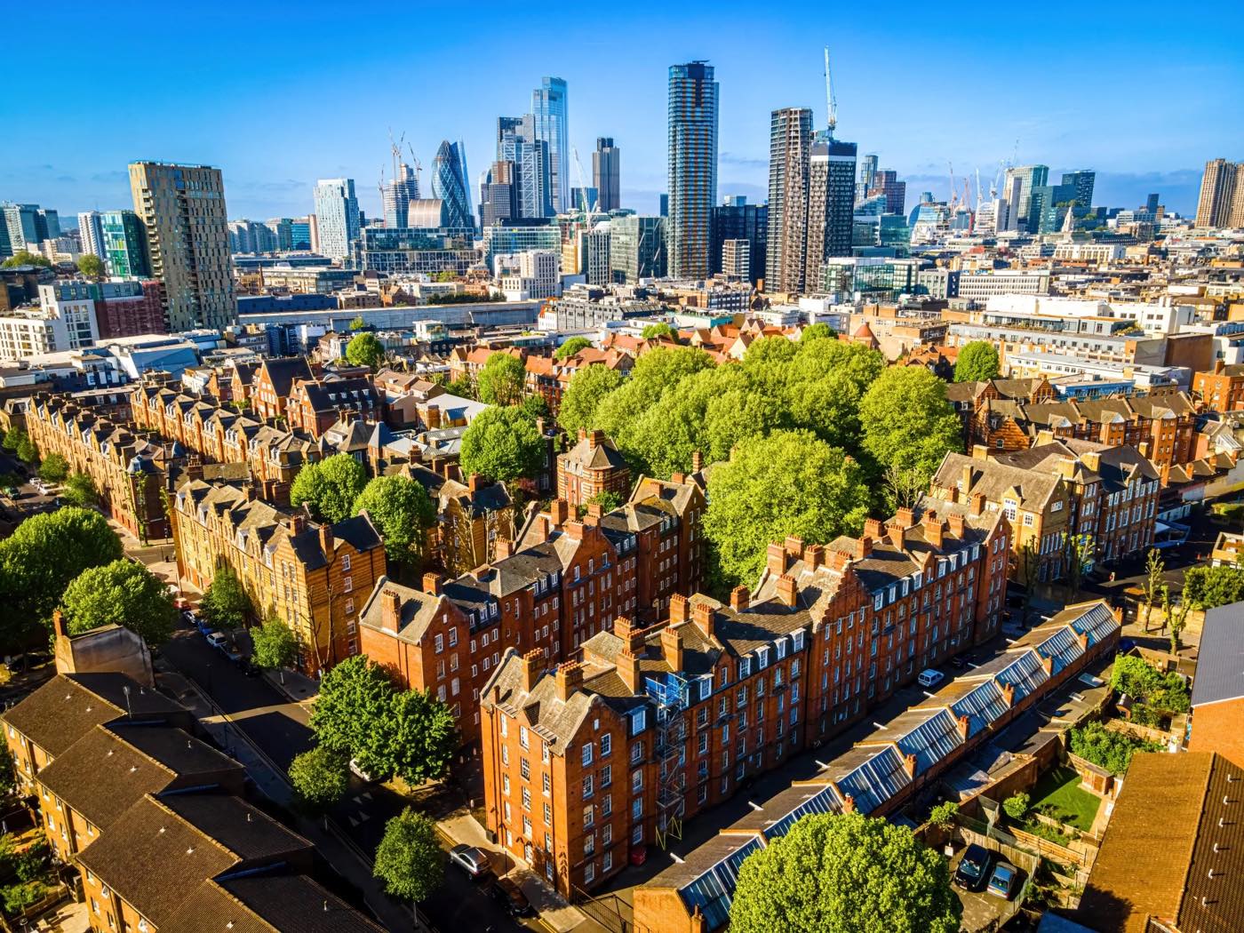 Victorian mansion blocks in Hackney with the City skyline beyond