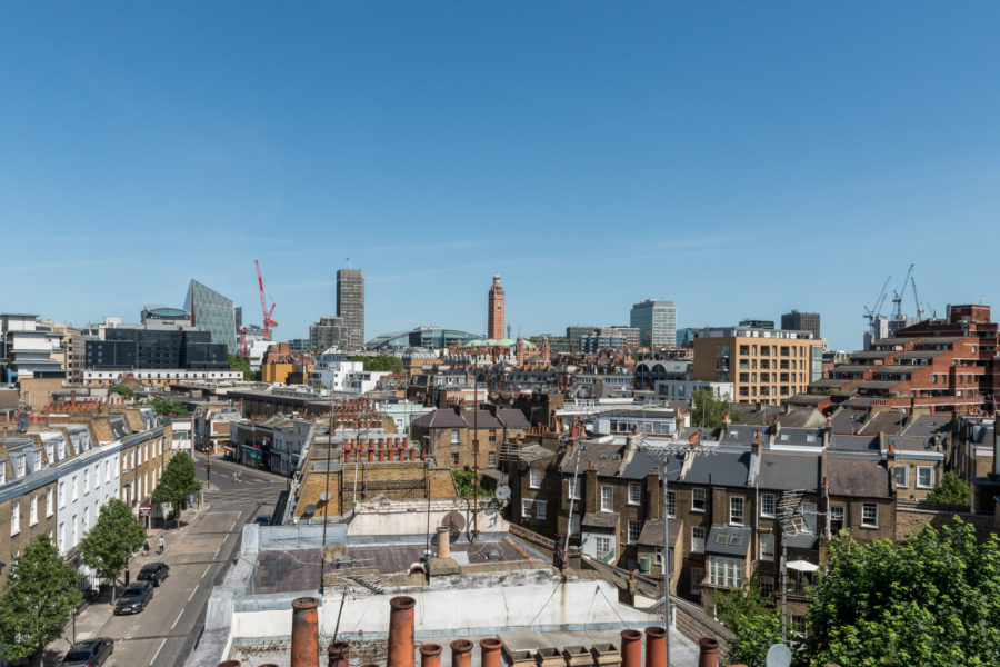 Rooftop view across London's chimneys and skyline
